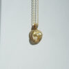 pendentif en or 750/1000e avec perle et diamant